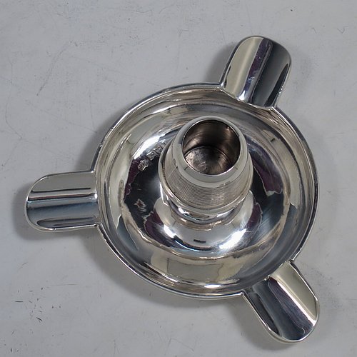 An Antique Edwardian Sterling Silver combination  match holder, striker, and ash-tray, having a plain round body, with three cigarette holders, and a central match holder with sloping striker sides, and all sitting on a flat base. Made by Charles Cooke of Chester in 1902. The dimensions of this fine hand-made antique silver match striker and ash-tray are diameter 7.5 cms (3 inches), height 6 cms (2.3 inches), and it weighs approx. 60g (2 troy ounces).  