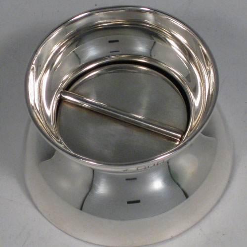    Antique Edwardian sterling silver flip top ashtray, having a plain round body, and an internal flip cover. Made in London in 1905. Height 5 cms (2 inches), diameter 7 cms (2.75 inches). Weight approx. 125g (4 troy ounces).