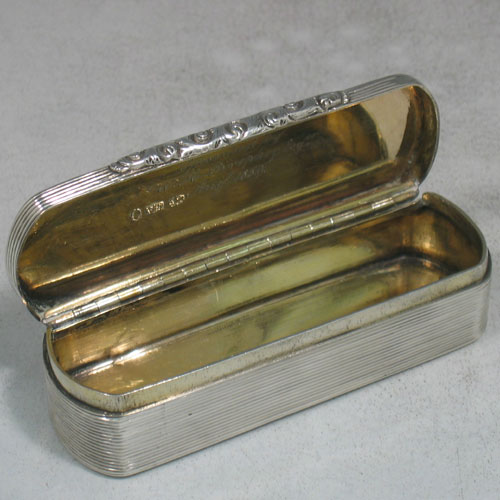 Antique Early Victorian sterling silver and gold-gilt snuff box made by Edward Smith of Birmingham in 1838 (Engraved inside with a contemporaneous inscription). Length 9 cms, width 3 cms.