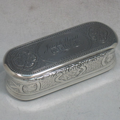    Antique Victorian sterling silver and gold-gilt snuff box made by George Unite of London in 1872. Originally presented to Joseph Wyatt, who we believe was the head groundsman of Wellbeck house. Hand engraved with floral work, and with three panels on base that have a thistle (for Scotland), a rose (for England), and a shamrock (for Ireland). Length 9 cms.