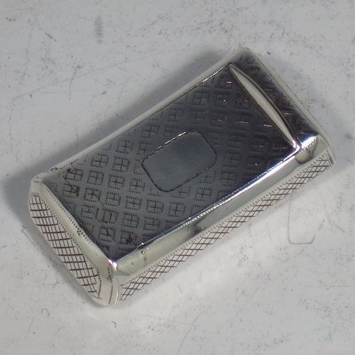 An Antique Georgian Sterling silver snuff box, having a rectangular body, with a slightly curved profile, with hand-engraved geometrical & floral decoration, a flat invisibly hinged lid with thumb-piece, and a gold-gilt interior. Made by Joseph Willmore of Birmingham in 1811. The dimensions of this fine hand-made antique silver snuff box are length 4.5 cms (1.75 inches), width 2.3 cms (0.8 inches), and it weighs approx. 17g (0.5 troy ounces).   