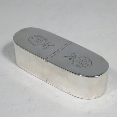 An Antique Georgian Sterling silver rare double compartment snuff box, having a plain rectangular body with rounded ends, straight sides, and a flat base, a central hinge with two fitted lids, and a gold-gilt interior. Made by Thomas Phipps & Edward Robinson of London 1793. The dimensions of this fine hand-made antique silver snuff box are length 9 cms (3.5 inches), width 3 cms (1.25 inches), depth 2 cms (0.75 inches), and it weighs approx. 71g (2.3 troy ounces). Please note that both lids are crested and monogrammed. 