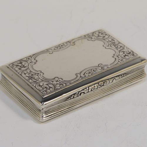 A beautiful Antique Victorian Sterling Silver snuff box, having a rectangular body with hand-engraved floral and scroll work, an applied cast foliate thumb-piece, and a gold-gilt interior. This elegant antique silver snuff box was made by Nathaniel Mills of Birmingham in 1850. The dimensions of this fine hand-made antique silver snuff box are length 7.5 cms (3 inches), width 4.5 cms (1.75 inches), depth 2 cms (0.6 inches), and it weighs approx. 69g (2.2 troy ounces).  