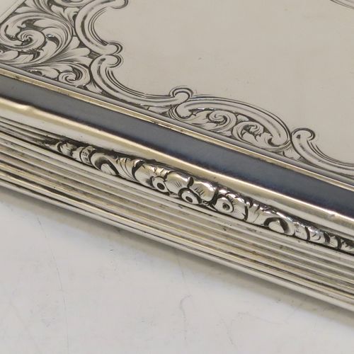 A beautiful Antique Victorian Sterling Silver snuff box, having a rectangular body with hand-engraved floral and scroll work, an applied cast foliate thumb-piece, and a gold-gilt interior. This elegant antique silver snuff box was made by Nathaniel Mills of Birmingham in 1850. The dimensions of this fine hand-made antique silver snuff box are length 7.5 cms (3 inches), width 4.5 cms (1.75 inches), depth 2 cms (0.6 inches), and it weighs approx. 69g (2.2 troy ounces).  