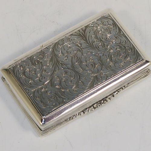 A beautiful Antique Victorian Sterling Silver snuff box, having a rectangular body with hand-engraved floral and scroll work, an applied cast foliate thumb-piece, and a gold-gilt interior. This elegant antique silver snuff box was made by Nathaniel Mills of Birmingham in 1850. The dimensions of this fine hand-made antique silver snuff box are length 7.5 cms (3 inches), width 4.5 cms (1.75 inches), depth 2 cms (0.6 inches), and it weighs approx. 69g (2.2 troy ounces).  