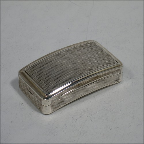 A very handsome Antique Georgian Sterling Silver snuff box, having a rectangular body which is also curved to fit the pocket, decorated with engine turning and hand-chased reeded borders, an applied thumb-piece, and with a gold gilt interior. The dimensions of this fine hand-made antique silver snuff box are length 7cm (2.75 inches), width 4.5 cms (1.75 inches), depth 2.3 cms (0.8 inches), and it weighs approx. 77g (2.5 troy ounces).   