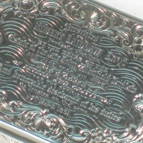 Antique Victorian sterling silver snuff box, having a rectangular body with hand-engraved floral decoration, a hinged lid with thumb-pieces, and a gold-gilt interior. Made by Taylor and Perry of London in 1847. The dimensions of this fine hand-made silver snuff box are length 10 cms (4 inches), width 5.7 cms (2.25 inches), height 2.5 cms (1 inch), and it weighs approx. 147g (4.7 troy ounces). Please note that this item is engraved with a full contemporaneous presentation inscription.