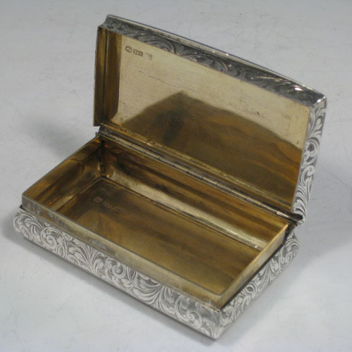 Antique Victorian sterling silver snuff box, having a rectangular body with hand-engraved floral decoration, a hinged lid with thumb-pieces, and a gold-gilt interior. Made by Taylor and Perry of London in 1847. The dimensions of this fine hand-made silver snuff box are length 10 cms (4 inches), width 5.7 cms (2.25 inches), height 2.5 cms (1 inch), and it weighs approx. 147g (4.7 troy ounces). Please note that this item is engraved with a full contemporaneous presentation inscription.