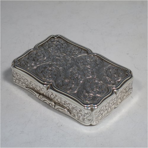 An Antique Victorian Sterling silver large snuff box, having a shaped rectangular body with hand-engraved floral work, an applied cast foliate thumb-piece, and a gold-gilt interior. Made by Nathaniel Mills of Birmingham in 1850. The dimensions of this fine hand-made antique silver snuff box are length 8.5 cms (3.3 inches), width 6 cms (2.3 inches), depth 2 cms (0.6 inches), and it weighs approx. 108g (3.5 troy ounces).   