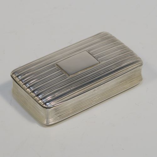 A very handsome Antique late Georgian Sterling Silver snuff box, having a rectangular body with hand-chased reeded decoration, a vacant rectangular cartouche on one side, and with a gold gilt interior. The dimensions of this fine hand-made antique silver snuff box are length 8cm (3 inches), width 4.5 cms (1.75 inches), depth 1.75 cms (0.7 inches), and it weighs approx. 92g (3 troy ounces).   