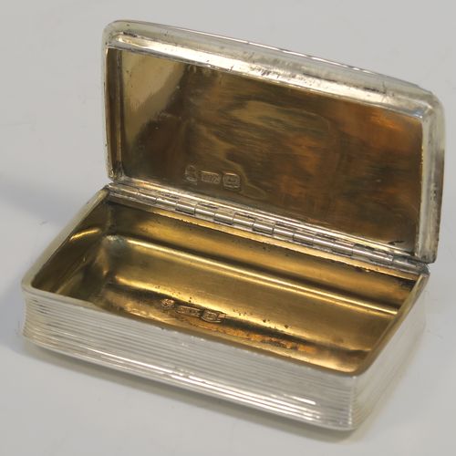 A very handsome Antique late Georgian Sterling Silver snuff box, having a rectangular body with hand-chased reeded decoration, a vacant rectangular cartouche on one side, and with a gold gilt interior. The dimensions of this fine hand-made antique silver snuff box are length 8cm (3 inches), width 4.5 cms (1.75 inches), depth 1.75 cms (0.7 inches), and it weighs approx. 92g (3 troy ounces).   