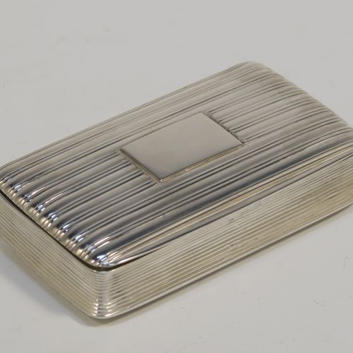 A very handsome Antique late Georgian Sterling Silver snuff box, having a rectangular body with hand-chased reeded decoration, a vacant rectangular cartouche on one side, and with a gold gilt interior. The dimensions of this fine hand-made antique silver snuff box are length 8cm (3 inches), width 4.5 cms (1.75 inches), depth 1.75 cms (0.7 inches), and it weighs approx. 92g (3 troy ounces).   