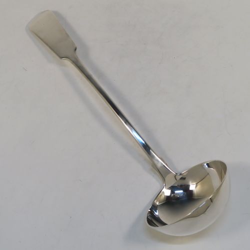 A very handsome Antique Scottish Georgian (William IV) Sterling Silver soup ladle in the Fiddle pattern, having a plain handle with a pip on the reverse, and a plain oval bowl with a heel on the reverse. This elegant antique silver soup ladle was made by James McKay of Edinburgh in 1836. The dimensions of this fine hand-made antique silver soup ladle are length 34.5 cms (13.5 inches), and it weighs approx. 248g (8 troy ounces).   