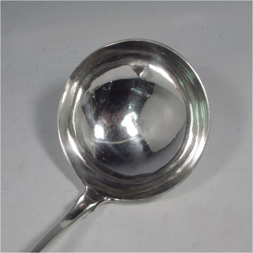 A rare Antique Georgian sterling silver Irish soup ladle in the Fiddle pattern, having a plain handle with a pip on the reverse, and a plain round bowl with shoulders above. Made in Dublin in 1781. The dimensions of this fine hand-made silver soup ladle are length 36.5 cms (14.3 inches), and it weighs approx. 191g (6.2 troy ounces). Please note that this item is crested.