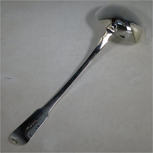 An Antique Georgian Sterling Silver soup ladle in the Fiddle pattern, having a plain handle with a pip on the reverse, and a plain round bowl with shoulders above and a heel on the reverse. Made by Sarah & John William Blake of London in 1820. The dimensions of this fine hand-made antique silver soup ladle are length 34 cms (13.5 inches), and it weighs approx. 280g (9 troy ounces). 