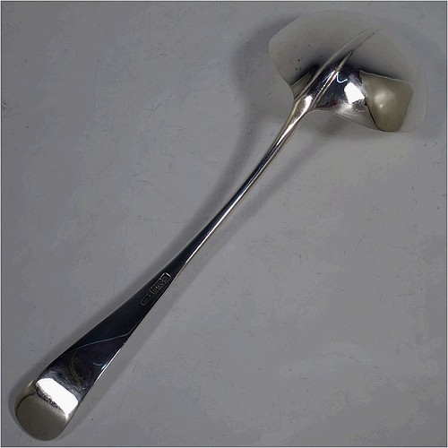 A very handsome Antique Edwardian Sterling Silver soup ladle in the Hanoverian Rattail pattern, having a plain handle with ridge and pip, and plain bowl with rattail on reverse. Made by Charles William Fletcher of Sheffield in 1905. The dimensions of this fine hand-made antique silver soup ladle are length 30 cms (11.75 inches), and it weighs approx. 251g (8 troy ounces).    