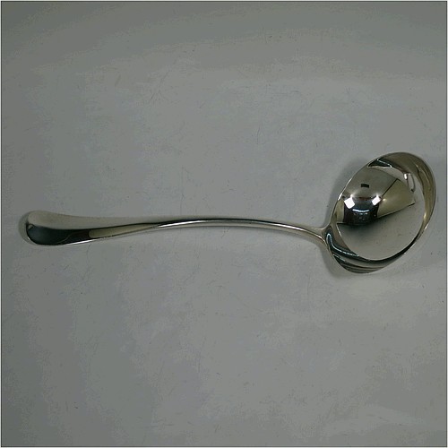 A very handsome Antique Edwardian Sterling Silver soup ladle in the Hanoverian Rattail pattern, having a plain handle with ridge and pip, and plain bowl with rattail on reverse. Made by Charles William Fletcher of Sheffield in 1905. The dimensions of this fine hand-made antique silver soup ladle are length 30 cms (11.75 inches), and it weighs approx. 251g (8 troy ounces).    