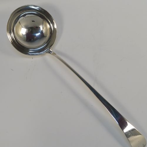 A handsome Antique Georgian Sterling Silver soup ladle in the Old English pattern, having a plain handle with a pip on the reverse, and a plain round bowl with a heel on the reverse. This elegant silver soup ladle was made by John Lambe of London in 1781. The dimensions of this fine hand-made antique silver soup ladle are length 33 cms (13 inches), and it weighs approx. 157g (5 troy ounces).   