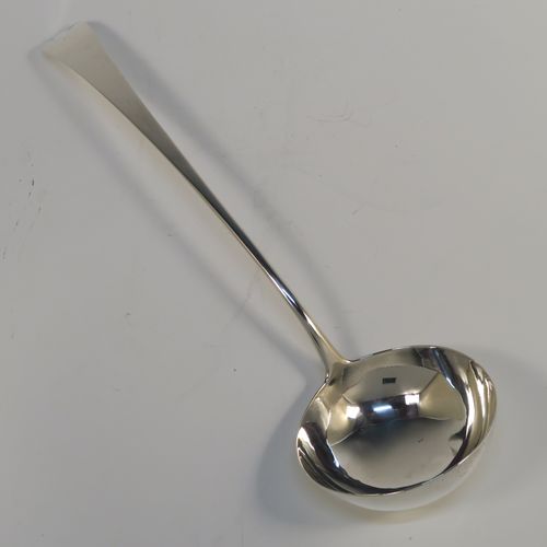 A handsome Antique Georgian Sterling Silver soup ladle in the Old English pattern, having a plain handle with a pip on the reverse, and a plain round bowl with a heel on the reverse. This elegant silver soup ladle was made by John Lambe of London in 1781. The dimensions of this fine hand-made antique silver soup ladle are length 33 cms (13 inches), and it weighs approx. 157g (5 troy ounces).   