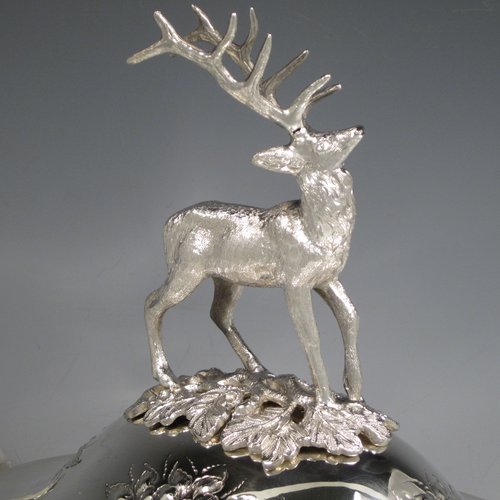 Antique Victorian silver plated soup tureen, having a pull-off lid with a cast model of a stag, with hand-chased floral decoration, applied bead-edged borders, two scroll side-handles, and all sitting on a pedestal foot. Made in ca. 1870. The dimensions of this fine hand-made silver-plated soup tureen and cover are height 33 cms (13 inches), length including handles 37 cms (14.5 inches), and width 20 cms (8 inches).   