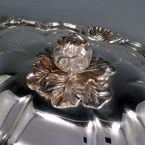 Antique Victorian silver plated soup tureen with pull-off lid, melon-style fluted body, cast floral and shell borders, and cast floral handles and feet. Made by G.R. Collis & Co., in ca. 1870. Height 26 cms (10.25 inches), length including handles 41 cms (16 inches), width 27 cms (10.5 inches). 