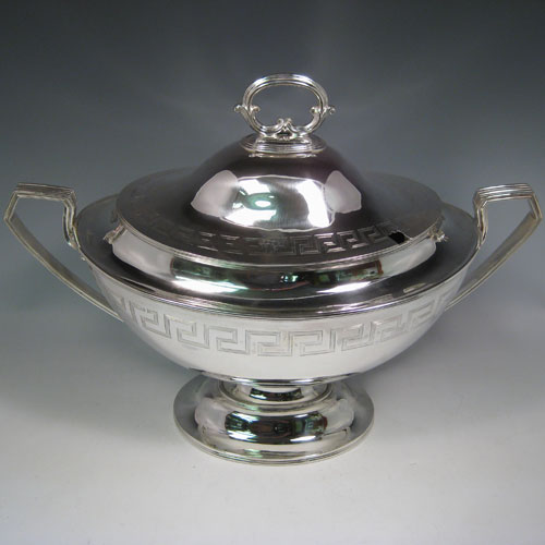 Antique Victorian sterling silver oval neoclassical style soup tureen and cover, with Greek-key style hand-engraving and reeded handles. Made by Walker & Hall of Sheffield in 1901. Height 33 cms (13 inches), length 46 cms (18 inches), width 23.5 cms (9.25 inches). Total weight approx. 91 troy ounces (2,281g).