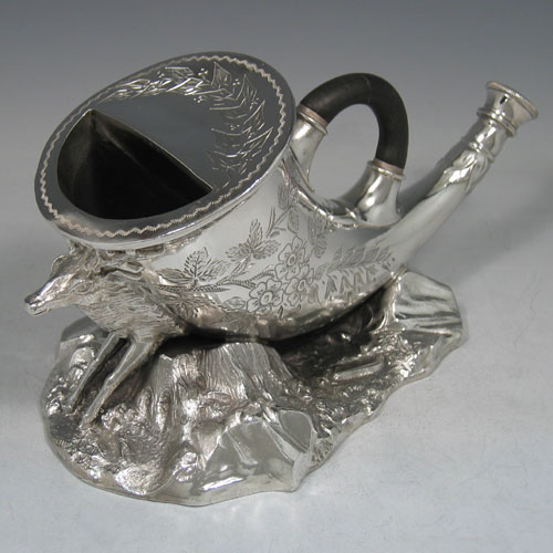    Antique Victorian silver plated hunting horn spoon warmer. With hand-engraved body and cast rock and stag base. Made in ca. 1870. Length 25 cms. Height 13 cms.