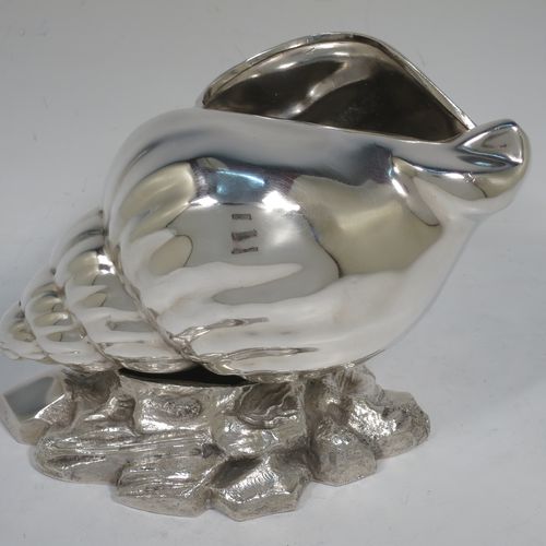 A handsome Antique Victorian Silver Plated spoon warmer, in the shape of a Conch shell, having a hand-chased body, and all sitting on a cast rock base with shells. Made in ca. 1880. The dimensions of this fine hand-made antique silver-plated spoon warmer are length 18 cms (7 inches), height 12 cms (4.75 inches), and width 10 cms (4 inches).   