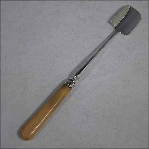 An Antique Georgian Sterling Silver and bone handled stilton cheese scoop, having a hand-cut handle, a hand-chased reeded ferrule, and a plain rounded cross-section stem with robust scoop. Made by Joseph Willmore of Birmingham in 1805. The dimensions of this fine hand-made antique silver and bone stilton cheese scoop are length 23.5 cms (9.25 inches).    