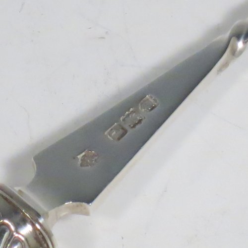 An Antique Victorian Sterling Silver and Ivory handled stilton cheese scoop, having a hand-cut spirally fluted handle, a hand-chased swirl-fluted ferrule, and a twisted stem with plain scoop. Made by William Hutton of London in 1899. The dimensions of this fine hand-made antique silver stilton cheese scoop are length 24 cms (9.5 inches).   