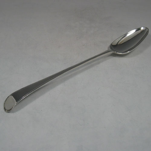    Antique Georgian, sterling silver Feather-edge pattern stuffing spoon, made by Hester Bateman of London in 1780. Length 28 cms.