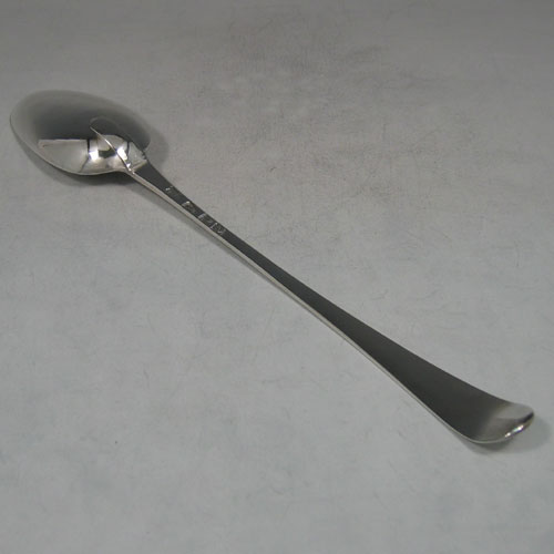    Antique Georgian, sterling silver Feather-edge pattern stuffing spoon, made by Hester Bateman of London in 1780. Length 28 cms.