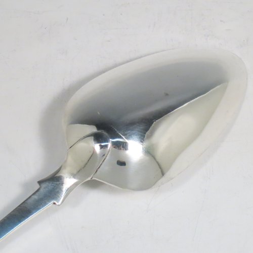 An Antique Georgian sterling silver Scottish Fiddle pattern stuffing spoon, having a very plain handle with pip on reverse, and a plain oval bowl. Made in Edinburgh in 1812. The dimensions of this fine hand-made antique silver stuffing spoon are length 31 cms (12.25 inches), and it weighs approx. 122g (4 troy ounces). Please note that this item is crested with Touch Not the Cat but a Glove for either the Mackpherson or Mackintosh clan.  