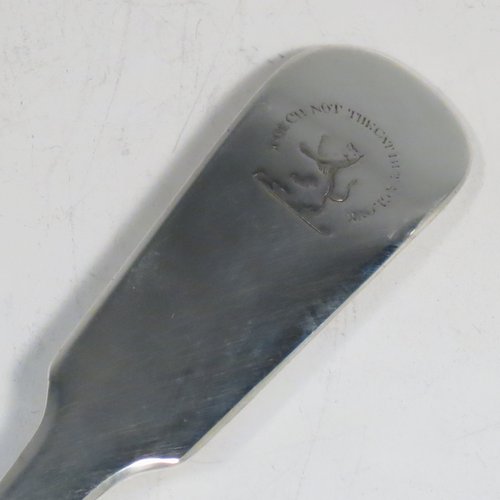 An Antique Georgian sterling silver Scottish Fiddle pattern stuffing spoon, having a very plain handle with pip on reverse, and a plain oval bowl. Made in Edinburgh in 1812. The dimensions of this fine hand-made antique silver stuffing spoon are length 31 cms (12.25 inches), and it weighs approx. 122g (4 troy ounces). Please note that this item is crested with Touch Not the Cat but a Glove for either the Mackpherson or Mackintosh clan.  