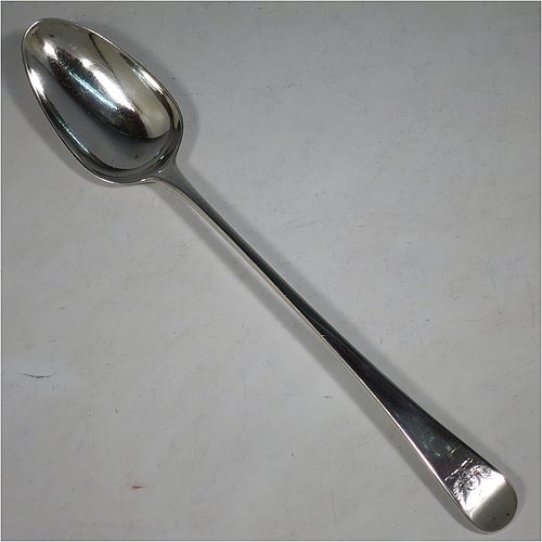 An Antique Georgian Sterling Silver Old English pattern stuffing spoon, having a very plain handle with pip on reverse, and a plain oval bowl. Made by George Smith III & William Fearn of London in 1787. The dimensions of this fine hand-made antique silver stuffing spoon are length 30 cms (11.75 inches), and it weighs approx. 120g (3.9 troy ounces). Please note that this item is crested.