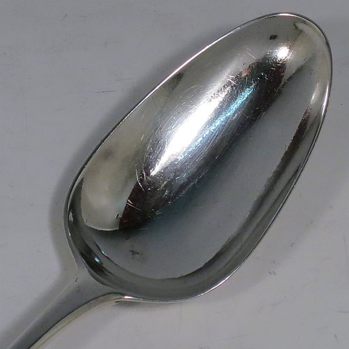 An Antique Georgian Sterling Silver Old English pattern stuffing spoon, having a very plain handle with pip on reverse, and a plain oval bowl. Made by George Smith III & William Fearn of London in 1787. The dimensions of this fine hand-made antique silver stuffing spoon are length 30 cms (11.75 inches), and it weighs approx. 120g (3.9 troy ounces). Please note that this item is crested.