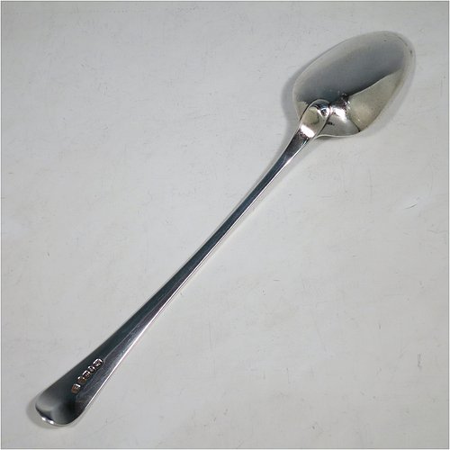 An Antique Georgian Sterling Silver Old English pattern stuffing spoon, having a very plain handle with pip on reverse, and a plain oval bowl. Made by George Smith III & William Fearn of London in 1787. The dimensions of this fine hand-made antique silver stuffing spoon are length 30 cms (11.75 inches), and it weighs approx. 120g (3.9 troy ounces). Please note that this item is crested.