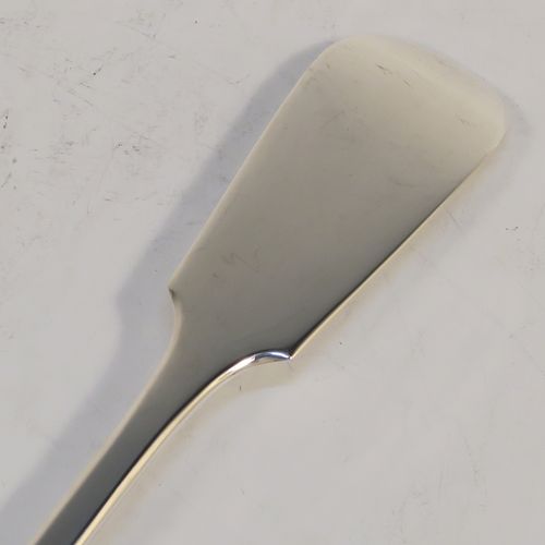 A handsome Antique Victorian Sterling Silver Fiddle pattern stuffing spoon, having a very plain handle with pip on reverse, and a plain oval bowl with shoulders above. This elegant antique silver serving spoon was made by the best Victorian flatware maker George Adams of London in 1884. The dimensions of this fine hand-made antique silver stuffing spoon are length 30.5 cms (12 inches), and it weighs approx. 130g (4.2 troy ounces).   