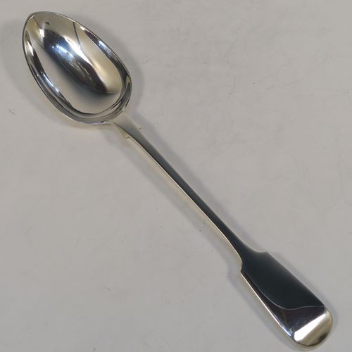 A handsome Antique Victorian Sterling Silver Fiddle pattern stuffing spoon, having a very plain handle with pip on reverse, and a plain oval bowl with shoulders above. This elegant antique silver serving spoon was made by Charles Boyton I of London in 1884. The dimensions of this fine hand-made antique silver stuffing spoon are length 31 cms (12.25 inches), and it weighs approx. 142g (4.6 troy ounces).  