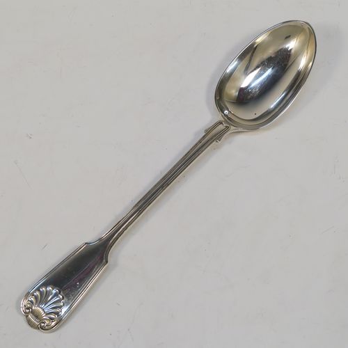 A handsome Antique Sterling Silver stuffing spoon in the double-struck Fiddle, Thread, and Shell patKings pattern. This beautiful antique silver stuffing or basting spoon was made by Francis Higgins of London in 1912. The dimensions of this fine hand-made silver stuffing spoon are length 30.5 cms (12 inches), and it weighs approx. 209g (6.7 troy ounces).  