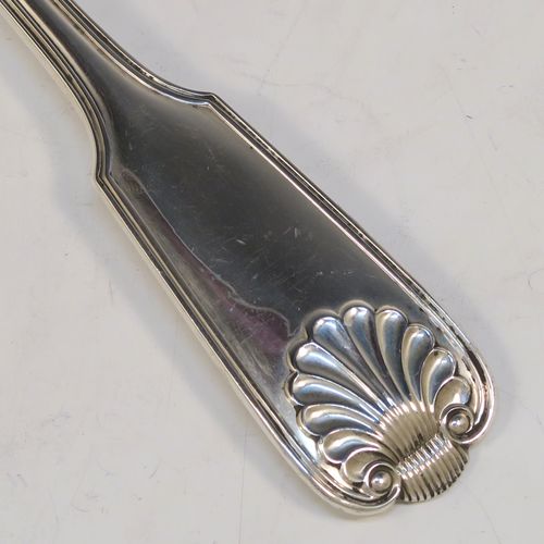 A handsome Antique Sterling Silver stuffing spoon in the double-struck Fiddle, Thread, and Shell patKings pattern. This beautiful antique silver stuffing or basting spoon was made by Francis Higgins of London in 1912. The dimensions of this fine hand-made silver stuffing spoon are length 30.5 cms (12 inches), and it weighs approx. 209g (6.7 troy ounces).  