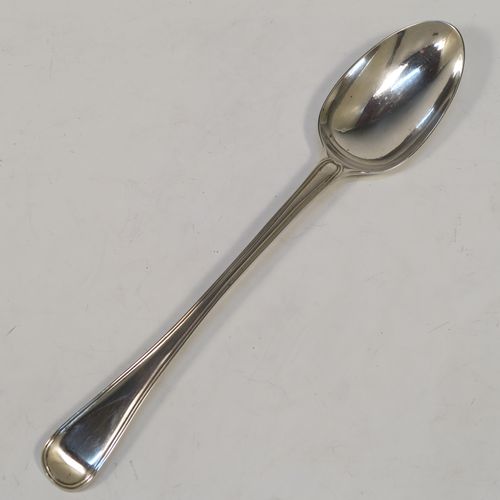 A handsome Antique Victorian Sterling Silver stuffing spoon in the double-struck Old English and Thread pattern. This elegant antique silver spoon was made by George Adams of London in 1848. The dimensions of this fine hand-made antique silver stuffing spoon are length 30.5 cms (12 inches), and it weighs approx. 150g (4.8 troy ounces).   