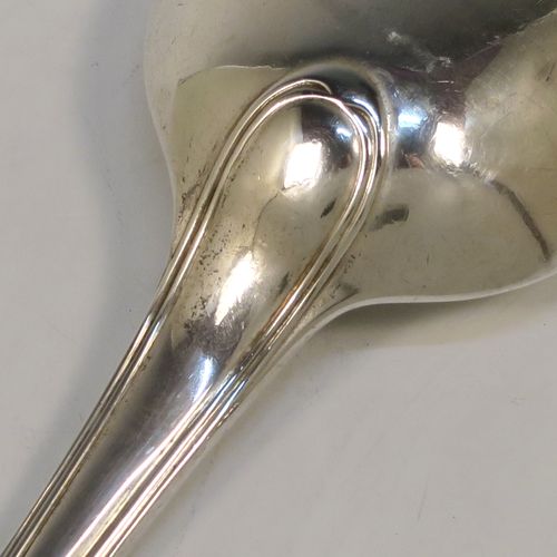 A handsome Antique Victorian Sterling Silver stuffing spoon in the double-struck Old English and Thread pattern. This elegant antique silver spoon was made by George Adams of London in 1848. The dimensions of this fine hand-made antique silver stuffing spoon are length 30.5 cms (12 inches), and it weighs approx. 150g (4.8 troy ounces).   