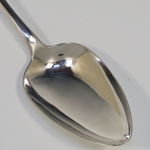 A handsome Antique Georgian Sterling Silver Old English pattern stuffing spoon, having a very plain handle with pip on reverse, and a plain oval bowl. This elegant silver serving spoon was made by George Ferris of Exeter in 1813. The dimensions of this fine hand-made antique silver stuffing spoon are length 30 cms (11.75 inches), and it weighs approx. 82g (2.6 troy ounces).   