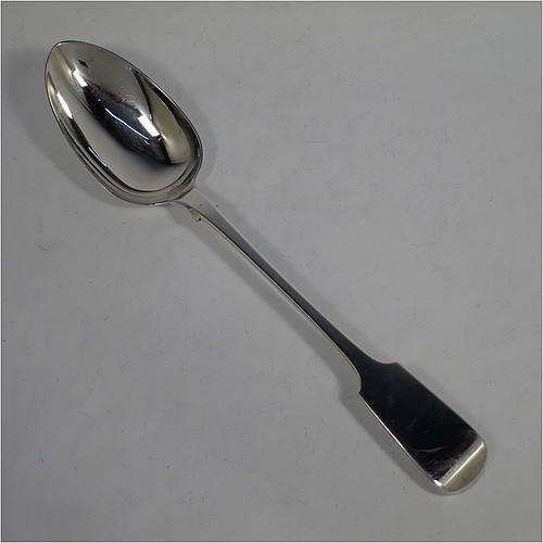 An Antique Georgian Sterling Silver heavy stuffing spoon in the Fiddle pattern, having a very plain handle with pip on reverse, and a plain oval bowl with shoulders above. Made by Clement Cheese of London in 1828. The dimensions of this fine hand-made antique silver stuffing spoon are length 30.5 cms (12 inches), and it weighs approx. 152g (4.9 troy ounces).    