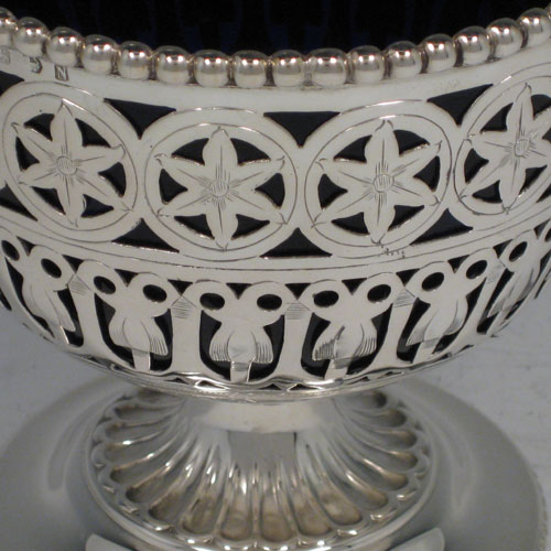    Antique Victorian sterling silver sugar basket with hand-engraved and pierced decoration, and with bead edges, and blue-glass liner. Made by Hirons & Plante of Birmingham in 1862. Height (including handle) 18 cms (7 inches), diameter 11.5 cms (4.5 inches). Weight approx. 6.5 troy ounces (202g). 