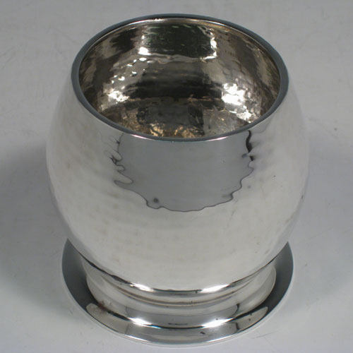 Sterling silver Arts and Crafts style sugar bowl, having a round convex body with a hand-hammered finish, sitting on a collet foot. Made in Glasgow in 1927. Height 7 cms (2.75 inches), diameter 7 cms (2.75 inches). Weight approx. 115g (3.7 troy ounces).