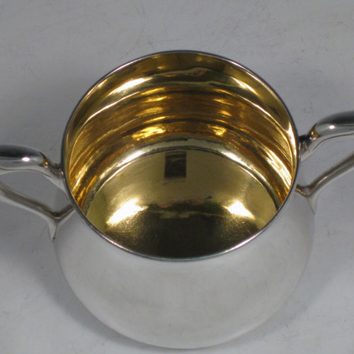 Antique Victorian sterling silver sugar bowl, having a plain round baluster body, with two scroll side-handles, a gold-gilt interior, and sitting on a flat base. Made by John Hunt and Robert Roskell (late Storr & Mortimer) of London in 1878. The dimensions of this fine hand-made silver sugar bowl are length 15 cms (6 inches), height 9 cms (3.5 inches), and it weighs approx. 274g (8.8 troy ounces).   