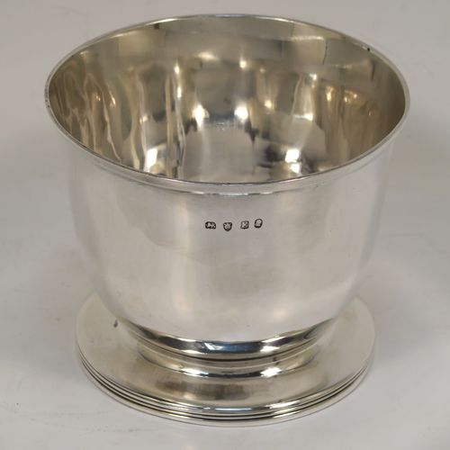 A handsome and rare Antique Georgian Sterling Silver sugar or sweetmeat bowl, having a plain round bellied body, with a hand-chased reeded border, and sitting on a pedestal foot. This elegant antique silver sugar bowl was made in London in 1800. The dimensions of this fine hand-made silver sweetmeat or sugar bowl are height 7.5 cms (3 inches), diameter 9 cms (3.5 inches), and it weighs approx. 167g (5.4 troy ounces).   