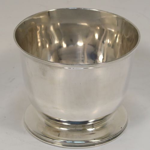 A handsome and rare Antique Georgian Sterling Silver sugar or sweetmeat bowl, having a plain round bellied body, with a hand-chased reeded border, and sitting on a pedestal foot. This elegant antique silver sugar bowl was made in London in 1800. The dimensions of this fine hand-made silver sweetmeat or sugar bowl are height 7.5 cms (3 inches), diameter 9 cms (3.5 inches), and it weighs approx. 167g (5.4 troy ounces).   